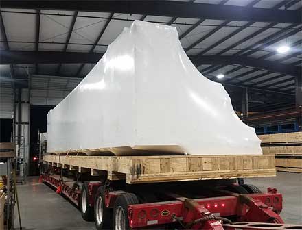 Vacuum packed equipment pallet and on a flatbed truck for shipping